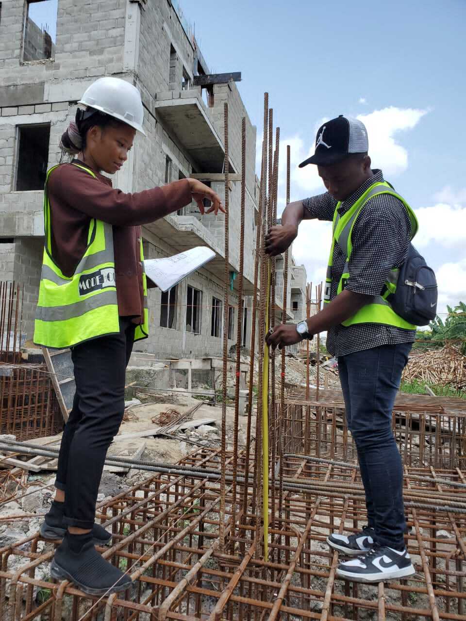 Engineer reviewing blueprints on site